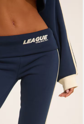Low Rise Fold Over Waistband League Graphic Contrast Stripe Flared Joggers In Navy Blue