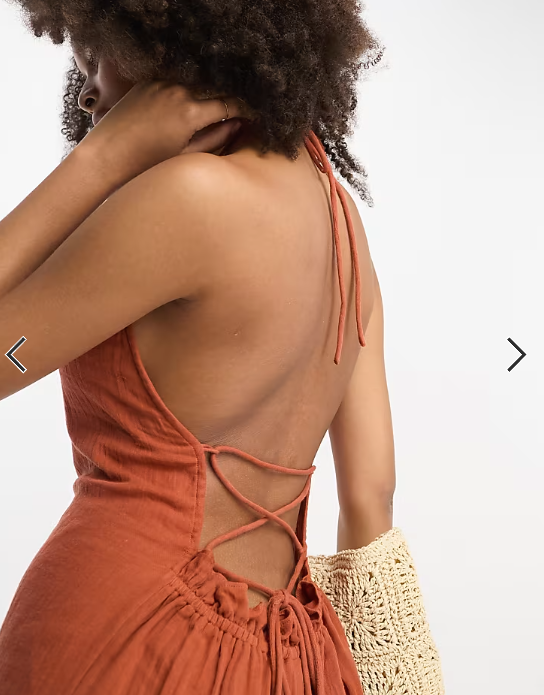 ASOS DESIGN - Tuta jumpsuit a fondo ampio con frange allacciata al collo stropicciata color ruggine