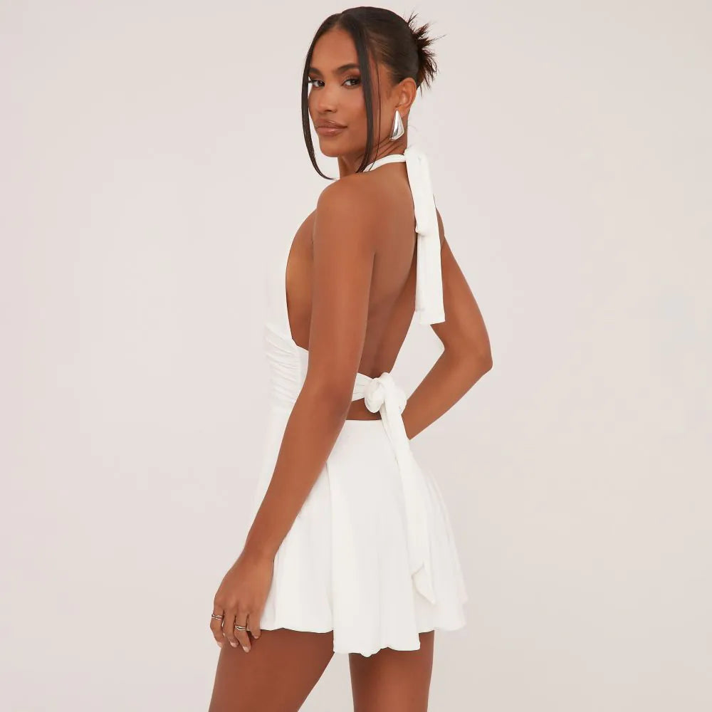 Plunge Halterneck Open Back Flippy Hem Mini Skater Dress In White Slinky