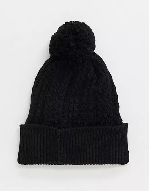 Bobble beanie in black cable knit