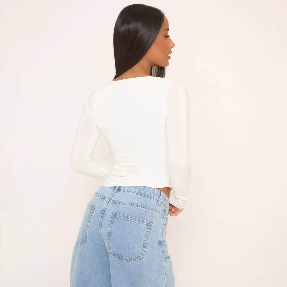 Long Sleeve Asymmetric Hem Top In White Slinky