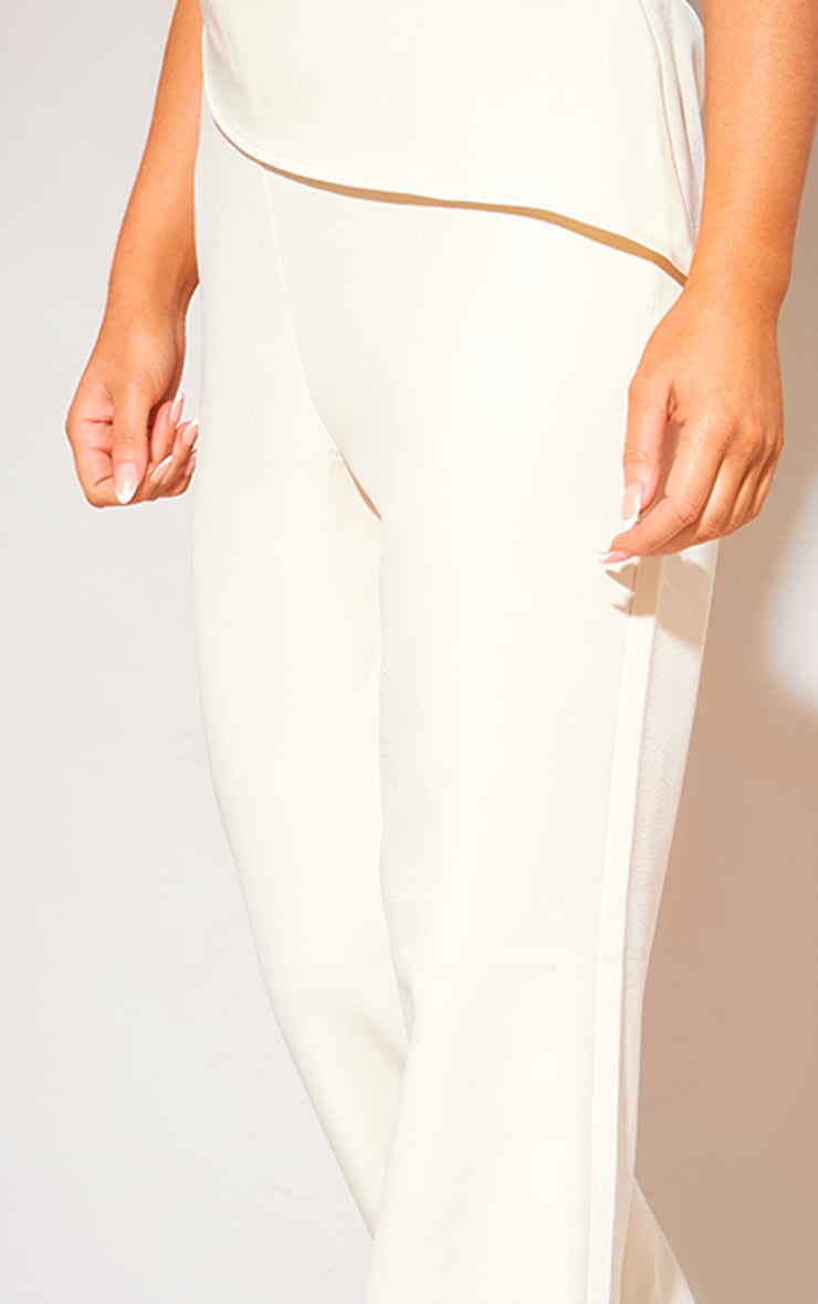 CREAM TAILORED LOW RISE SKINNY FLARED PANTS