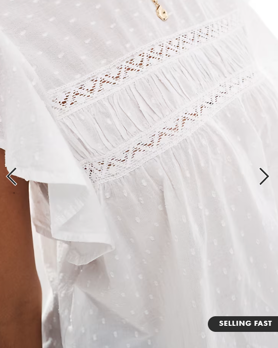 Vero Moda high neck flutter sleeved embroidered top in white