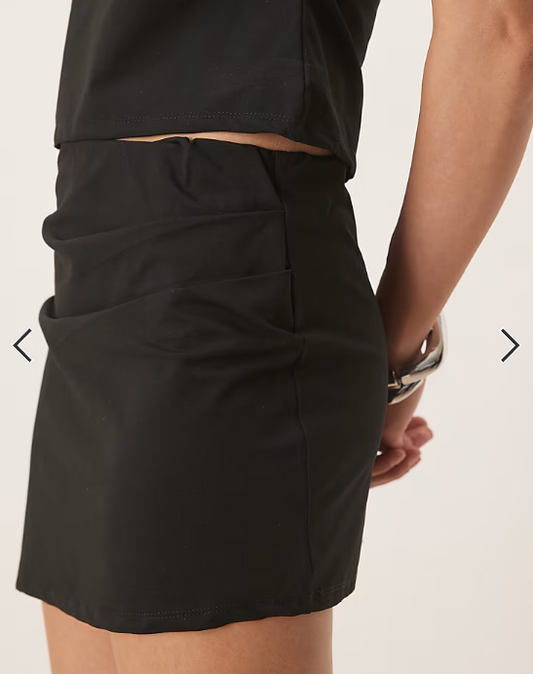 ASOS DESIGN co-ord asymmetric hem mini skirt with pleat detail in black