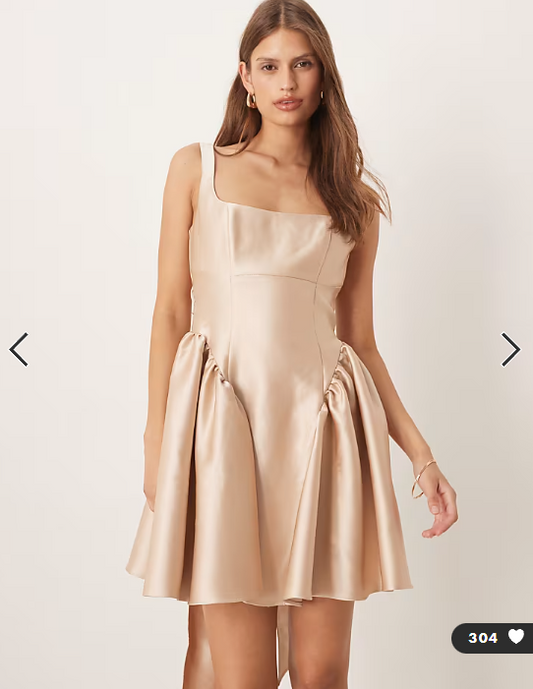 Six Stories drop hem bow back mini dress in soft gold
