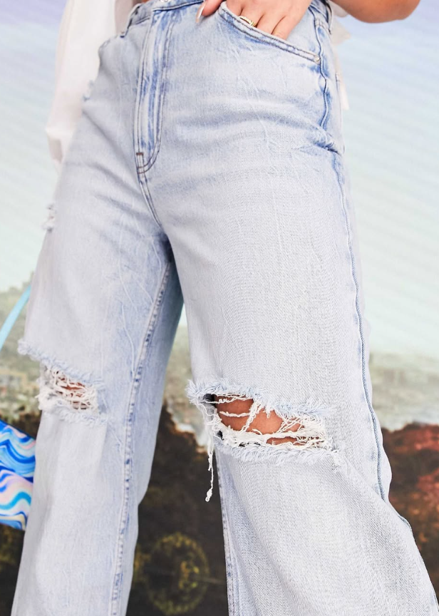 ASOS DESIGN × MILLIE wide leg ripped knee jean in light wash blue