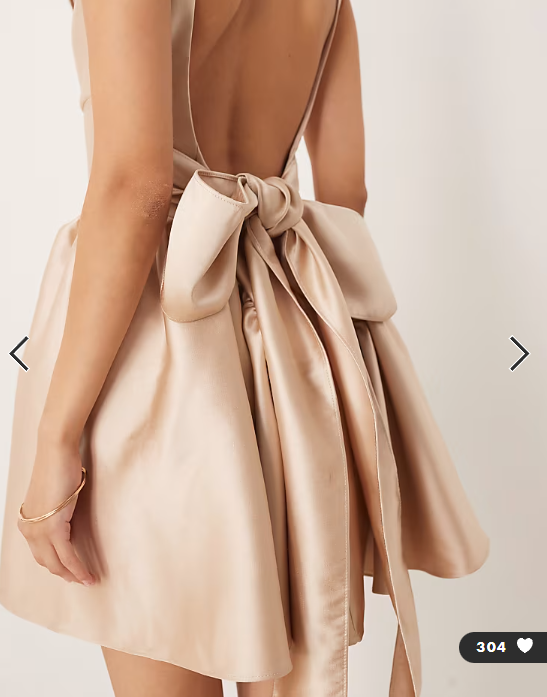 Six Stories drop hem bow back mini dress in soft gold