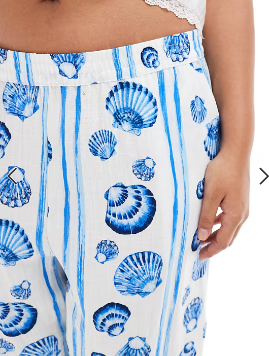 Vero Moda Curve wide leg trousers in blue seashell print