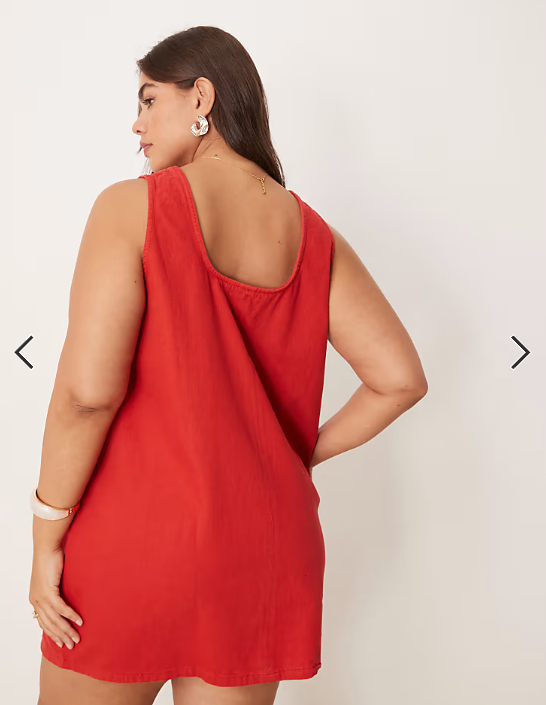 ASOS DESIGN Curve denim scoop mini dress with bow front in red