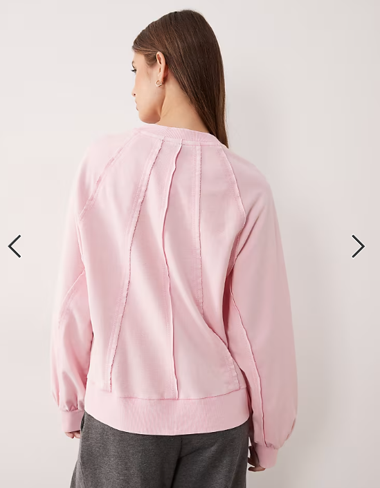 ASOS DESIGN seamed sweatshirt with panel detail in washed pink
