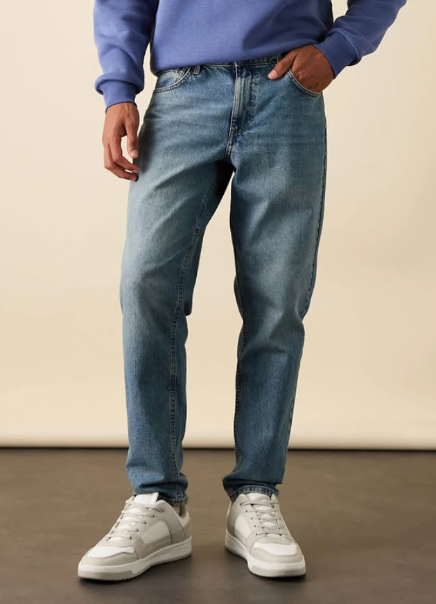 ASOS DESIGN tapered fit jeans in mid wash blue