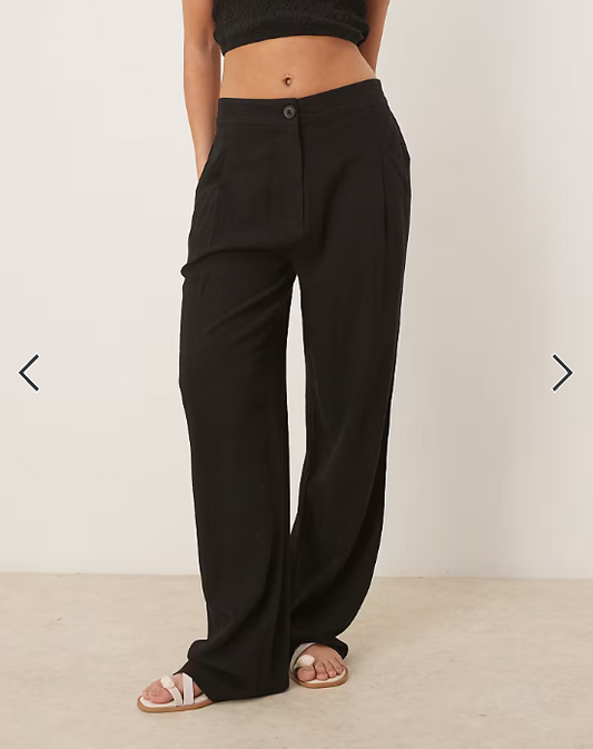 ASOS DESIGN pleat front tapered pants with linen in black