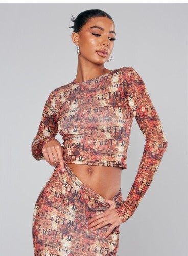 RED ABSTRACT PRINT LONG SLEEVED CROP TOP