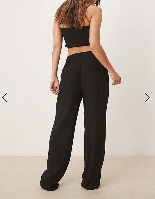 ASOS DESIGN pleat front tapered pants with linen in black
