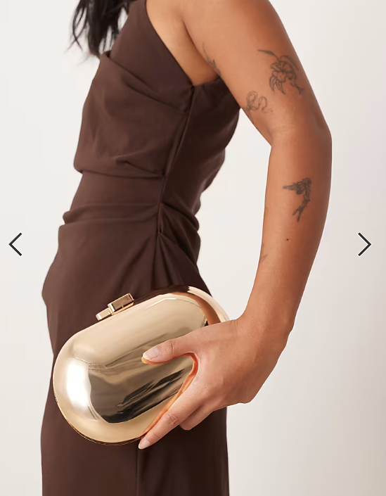 True Decadence oval hard clutch bag in gold