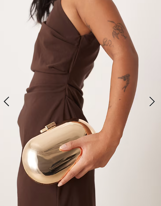 True Decadence oval hard clutch bag in gold