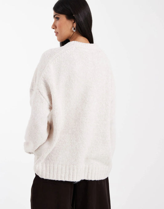 ASOS DESIGN oversized crew neck sweater with curved hem in cream