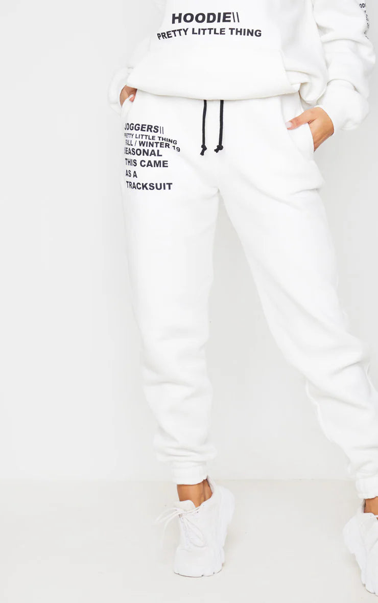 LOGO CREAM SLOGAN PRINTED JOGGERS